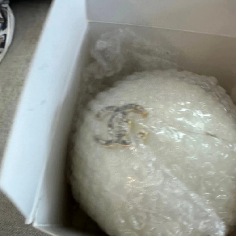 CHANEL White Round Vanity Case with Gold CC Emblem and Black Ribbon
